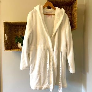 Soft, white hooded bathrobe.